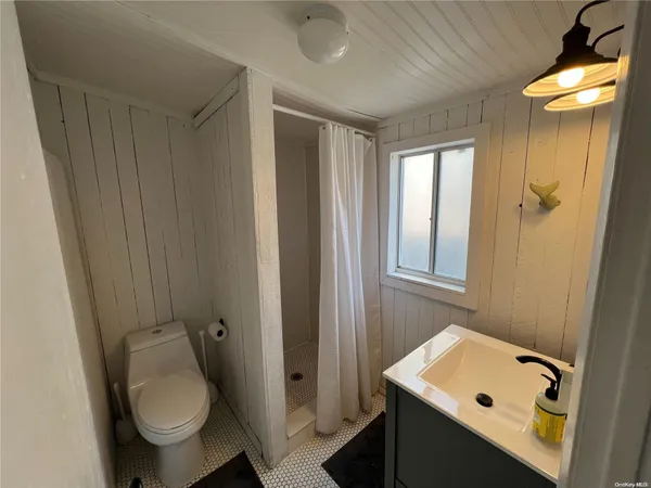 a view of a roof deck with wooden floor and fence