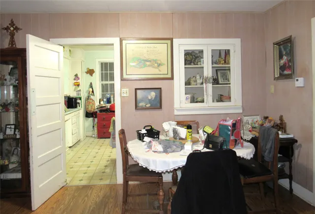 a view of a dining room with furniture and window