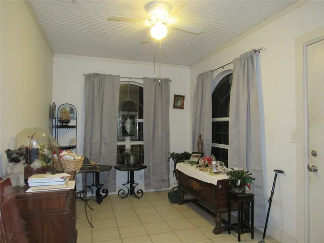 a living room with furniture and a large mirror