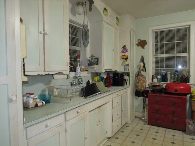 a kitchen with stainless steel appliances granite countertop a sink and cabinets