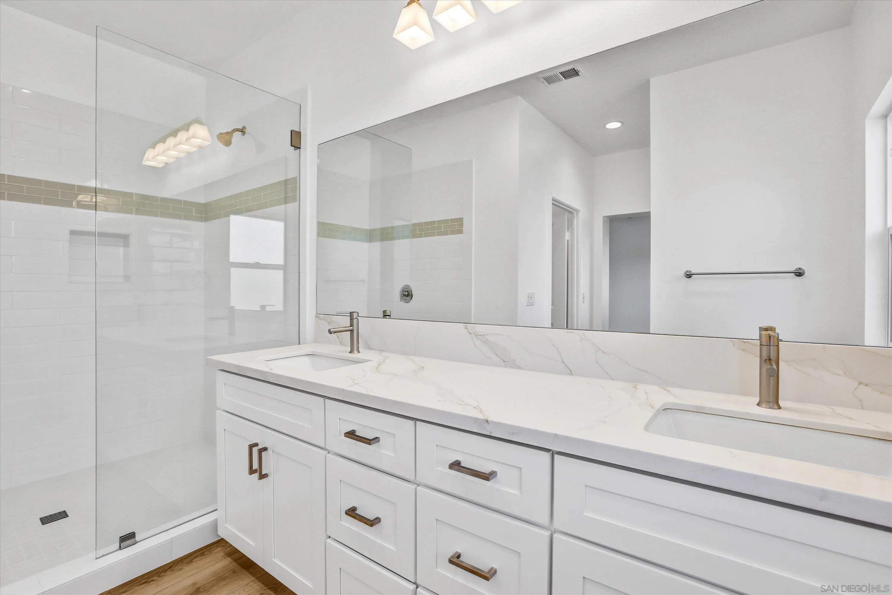 8540 Vista Azul Lemon Grove, CA 91945 - Photo 11 of 33 a bathroom with a sink and a mirror