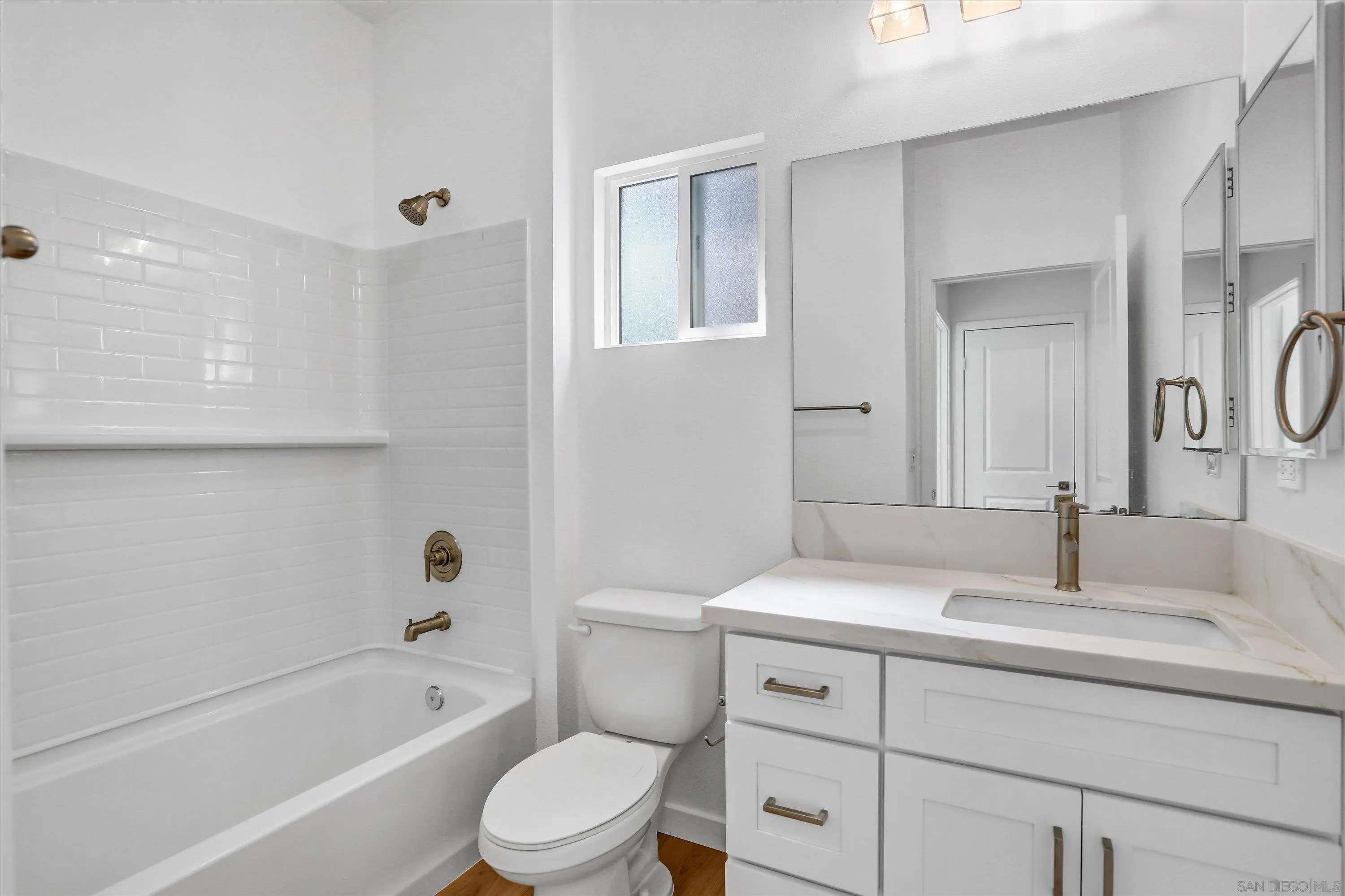 8540 Vista Azul Lemon Grove, CA 91945 - Photo 12 of 33 a bathroom with a sink a toilet and bathtub