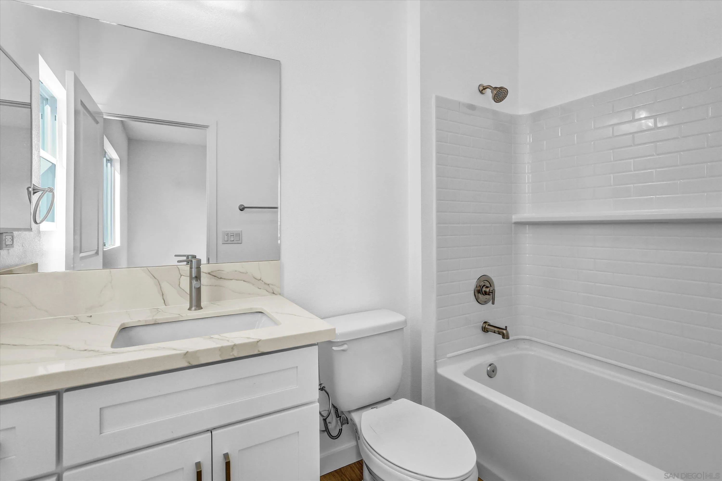 8540 Vista Azul Lemon Grove, CA 91945 - Photo 13 of 33 a bathroom with a sink a toilet and bathtub