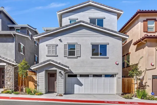 a front view of a house with garage