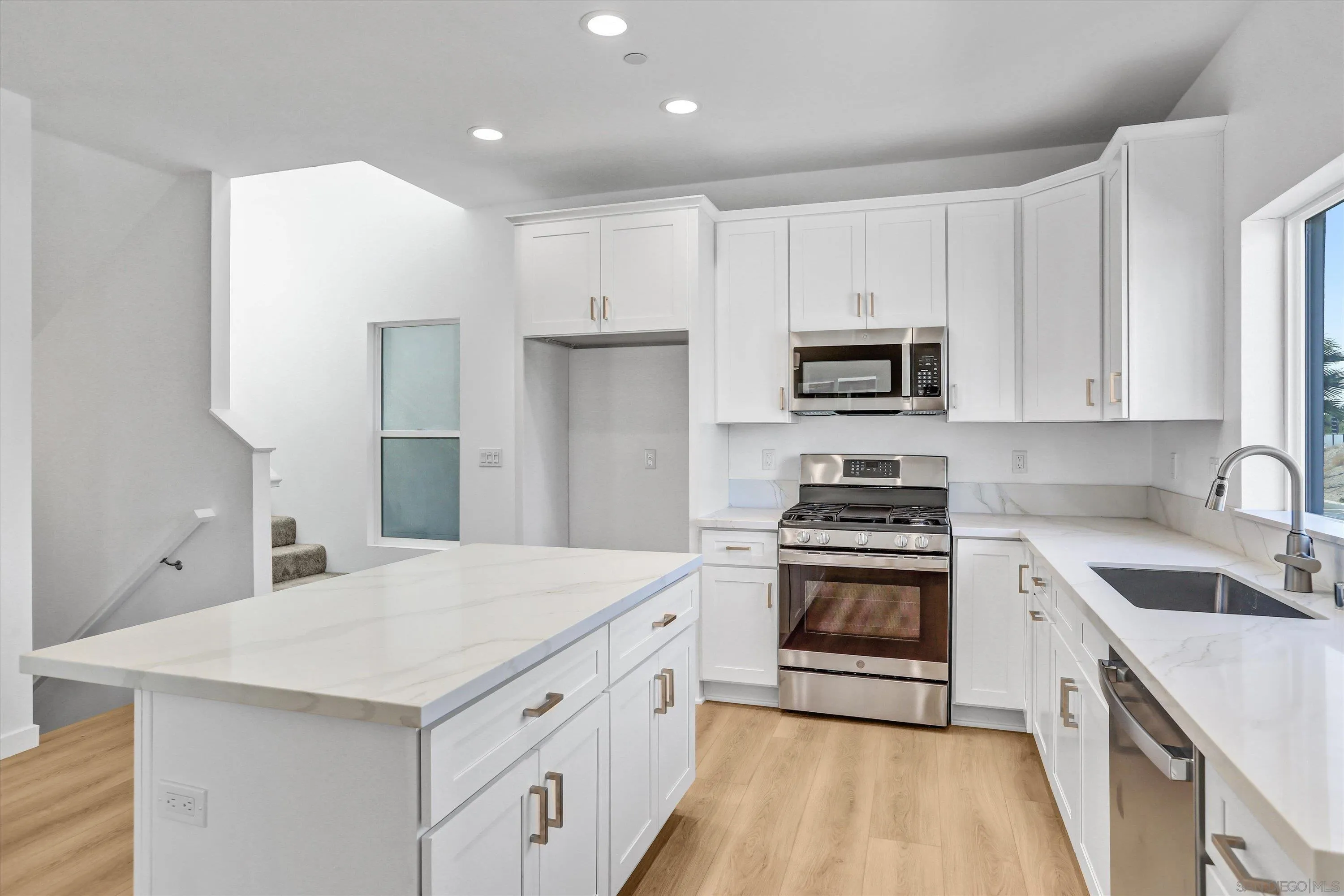8540 Vista Azul Lemon Grove, CA 91945 - Photo 6 of 33 a kitchen with a sink stove and refrigerator