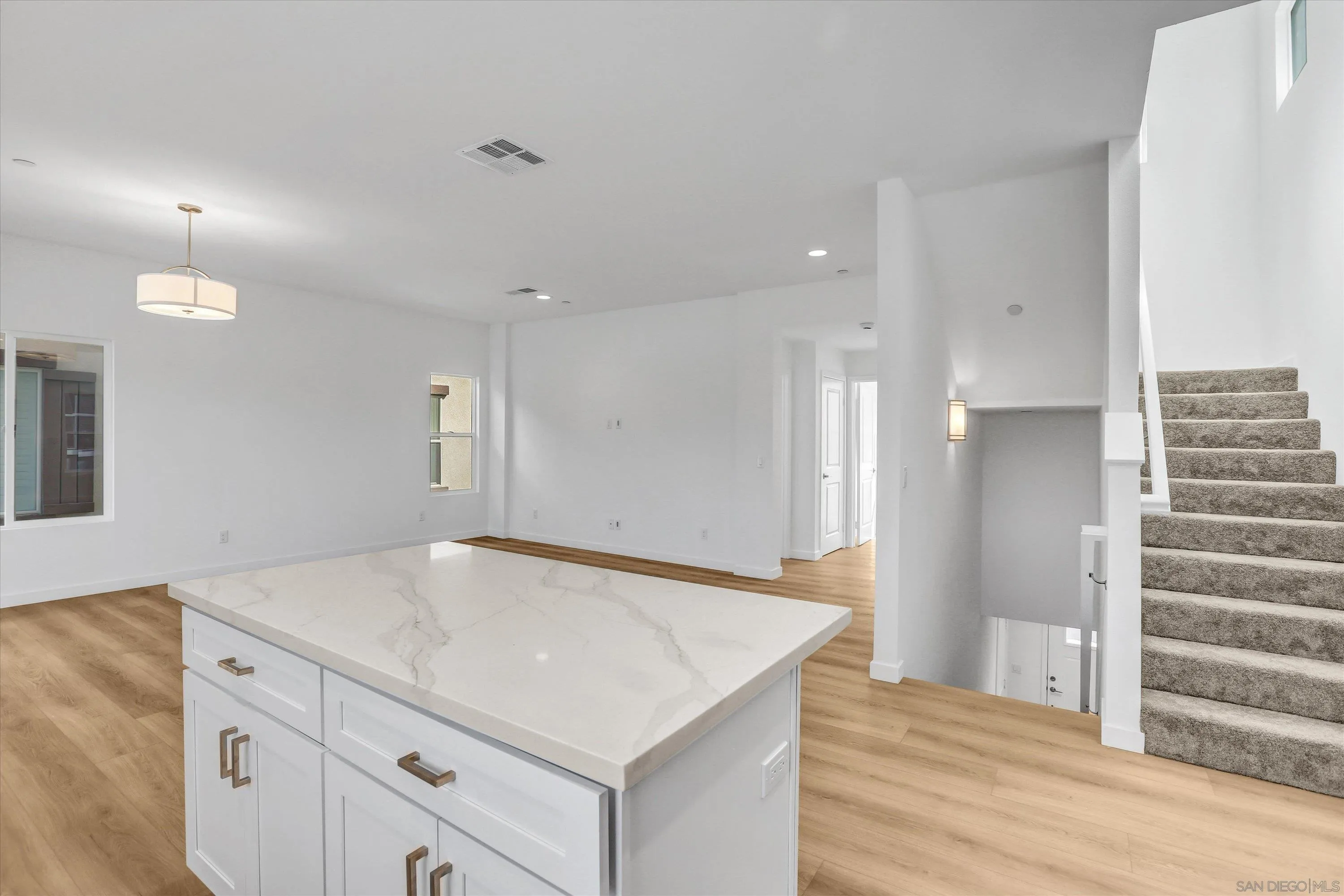 8540 Vista Azul Lemon Grove, CA 91945 - Photo 7 of 33 a view of kitchen and hall with wooden floor