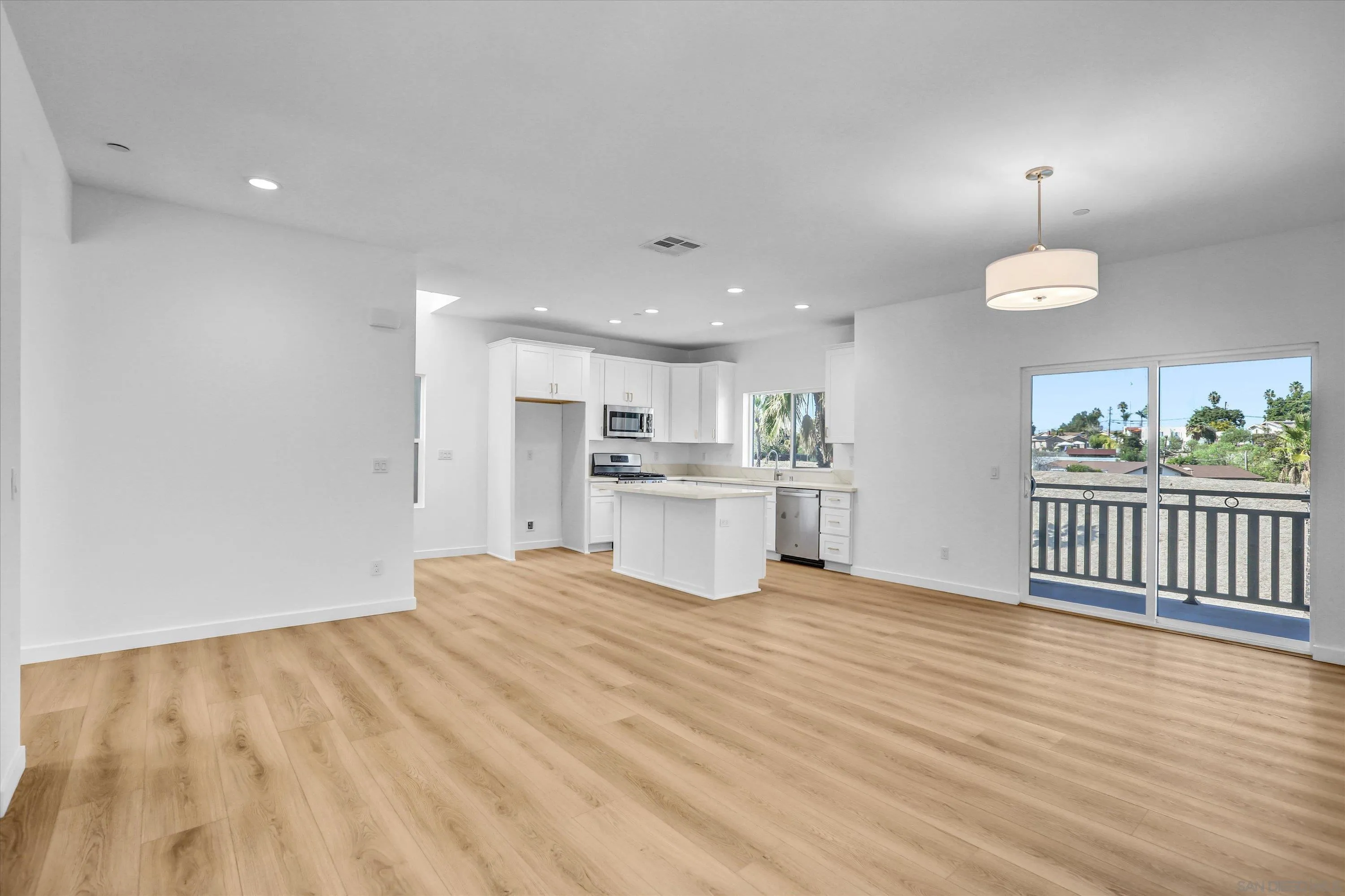 8540 Vista Azul Lemon Grove, CA 91945 - Photo 9 of 33 a view of a kitchen with wooden floor and a window
