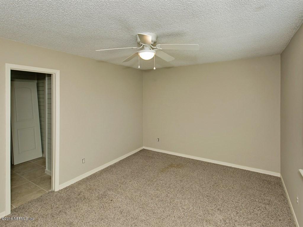 12788 Attrill Road Jacksonville, FL 32258 - Photo 15 of 20 an empty room with a fan and a window