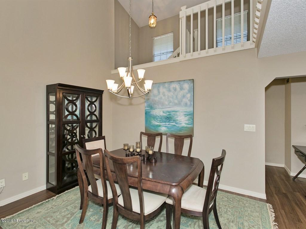 12788 Attrill Road Jacksonville, FL 32258 - Photo 3 of 20 a view of a dining room with furniture and chandelier