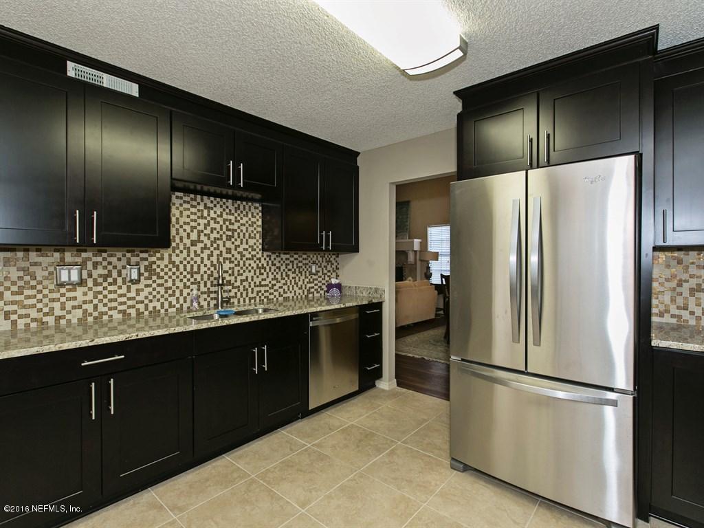 12788 Attrill Road Jacksonville, FL 32258 - Photo 6 of 20 a kitchen with stainless steel appliances granite countertop a refrigerator and a sink