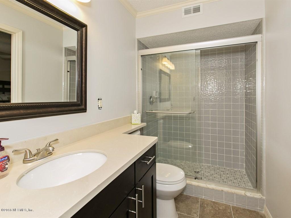 12788 Attrill Road Jacksonville, FL 32258 - Photo 10 of 20 a bathroom with a sink a toilet and shower