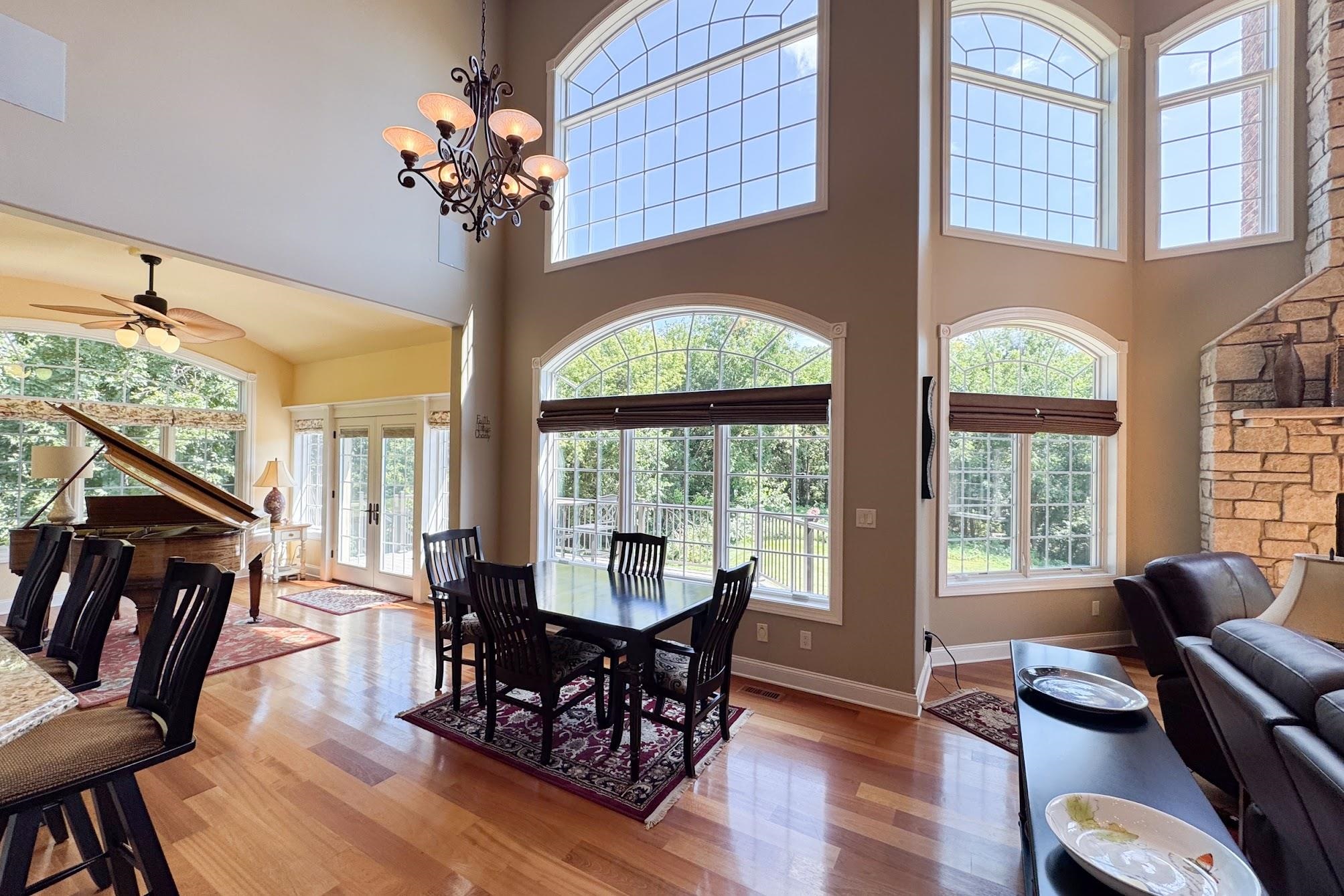 163 Russell Road Oregon, IL 61061 - Photo 11 of 64 a view of a dining room with furniture wooden floor and chandelier