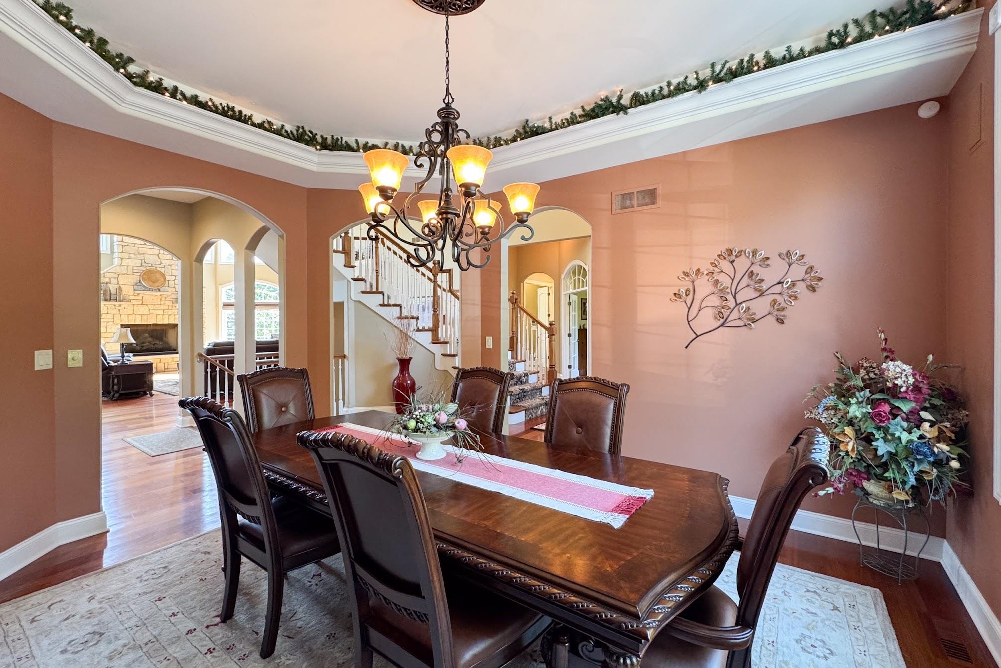 163 Russell Road Oregon, IL 61061 - Photo 19 of 66 a outdoor dining room with furniture a chandelier and a rug