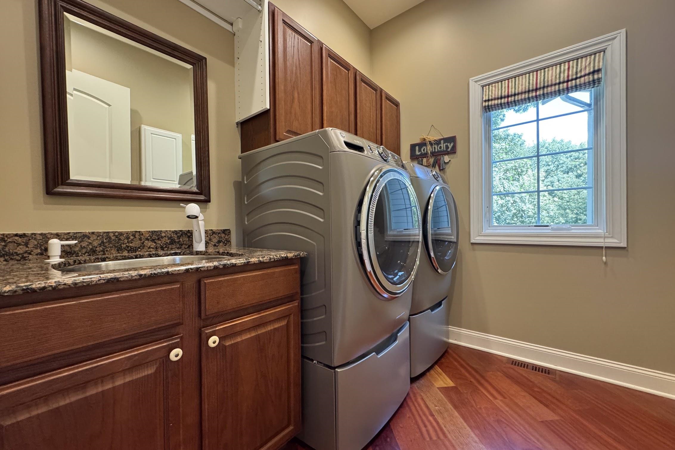 163 Russell Road Oregon, IL 61061 - Photo 26 of 64 a utility room with dryer and washer