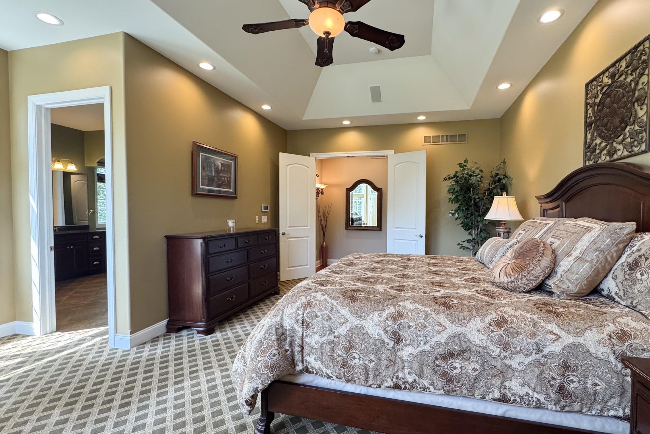 163 Russell Road Oregon, IL 61061 - Photo 29 of 64 a bedroom with a large bed and a dresser