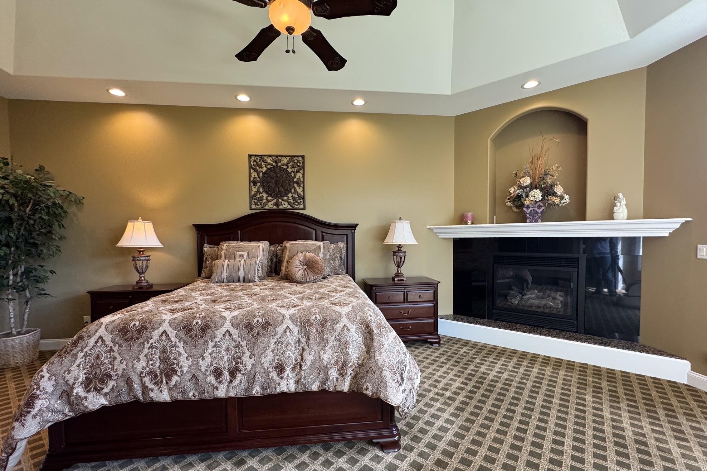 163 Russell Road Oregon, IL 61061 - Photo 32 of 66 a bedroom with a bed and a fireplace