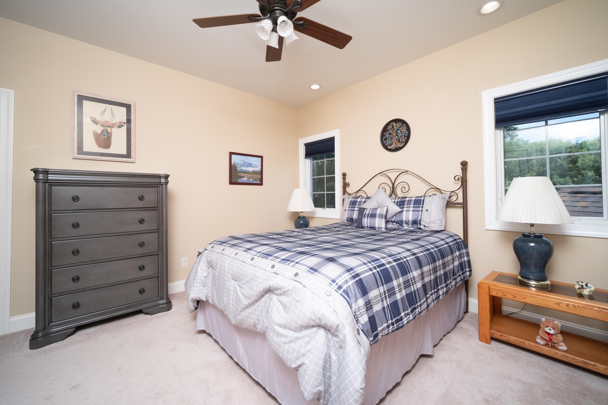 163 Russell Road Oregon, IL 61061 - Photo 39 of 66 a bedroom with a bed and a chandelier