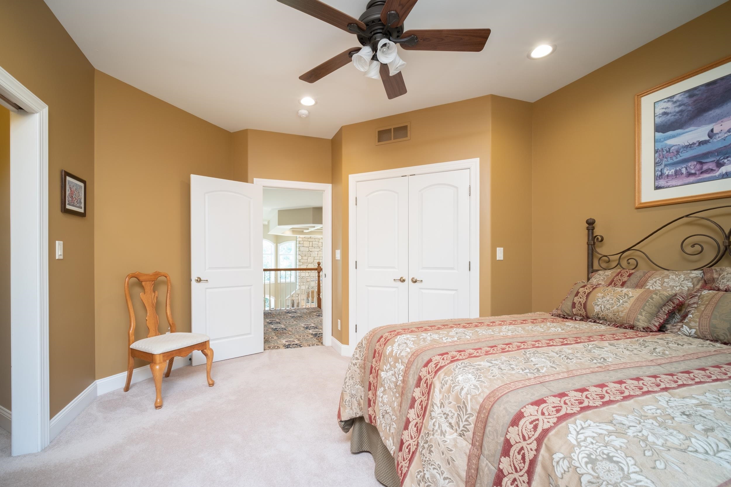 163 Russell Road Oregon, IL 61061 - Photo 40 of 64 a bedroom with a bed and a chandelier