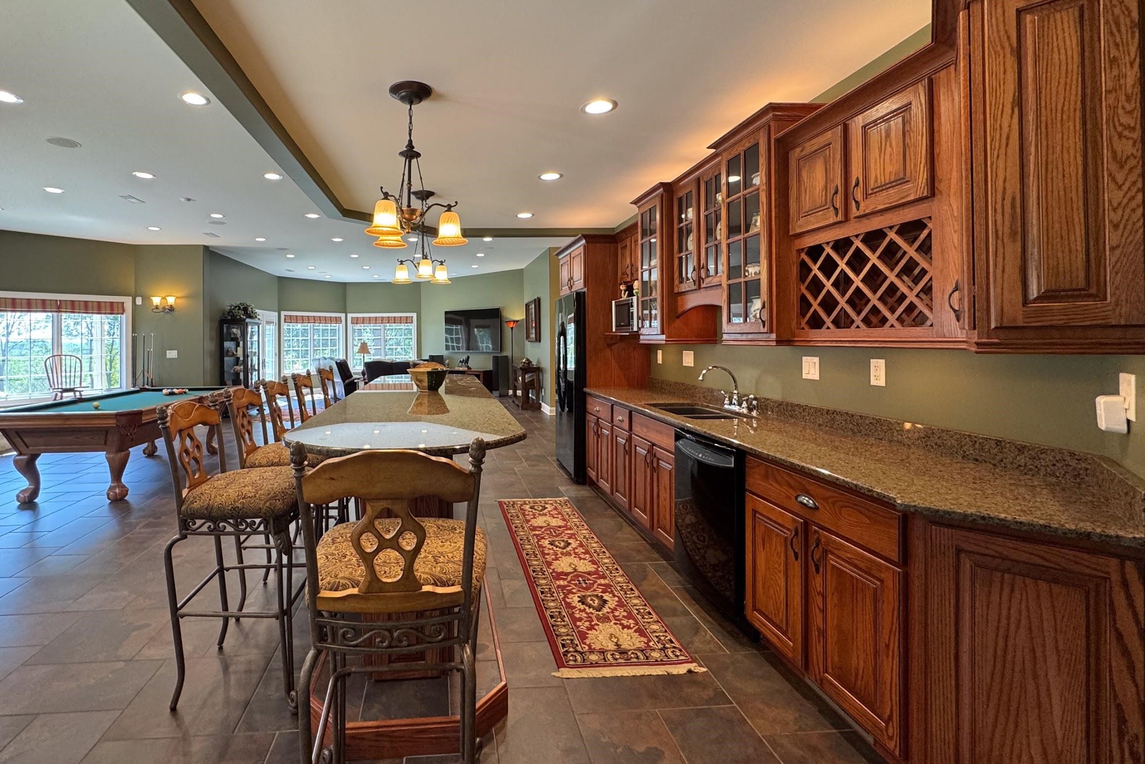 163 Russell Road Oregon, IL 61061 - Photo 43 of 64 a large kitchen with stainless steel appliances granite countertop a granite counter tops a stove a sink and a cabinets