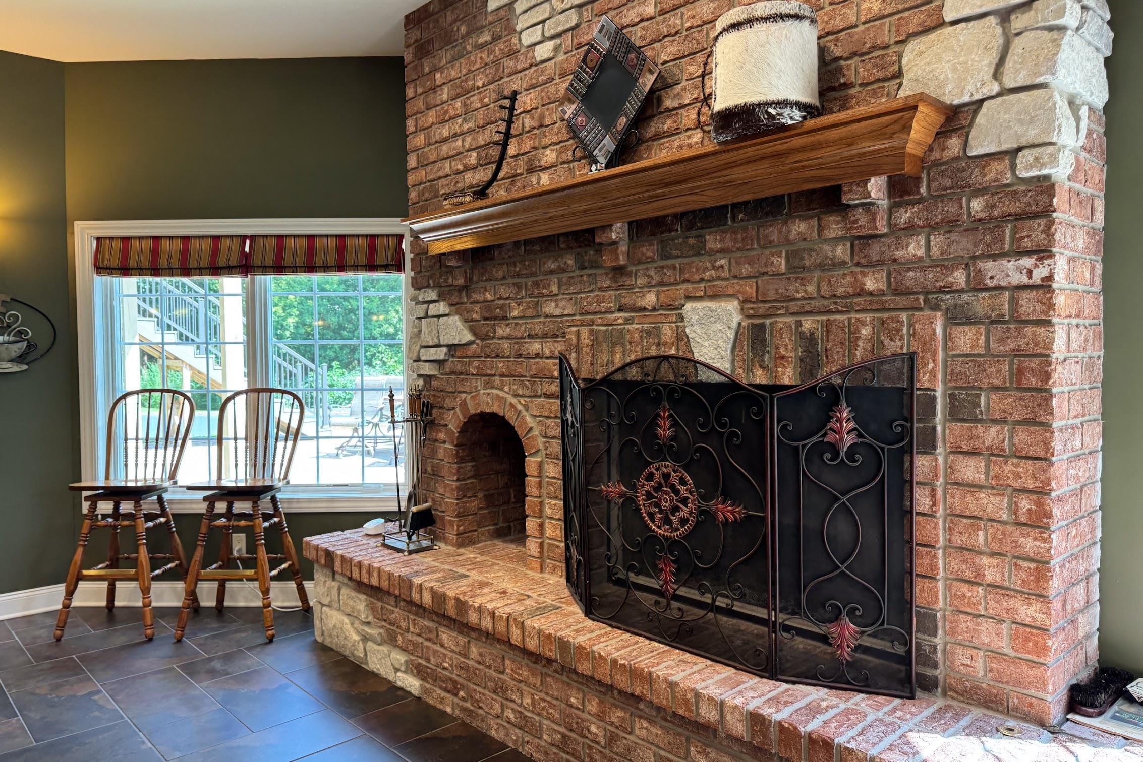 163 Russell Road Oregon, IL 61061 - Photo 49 of 64 a living room with furniture a fireplace and a floor to ceiling window