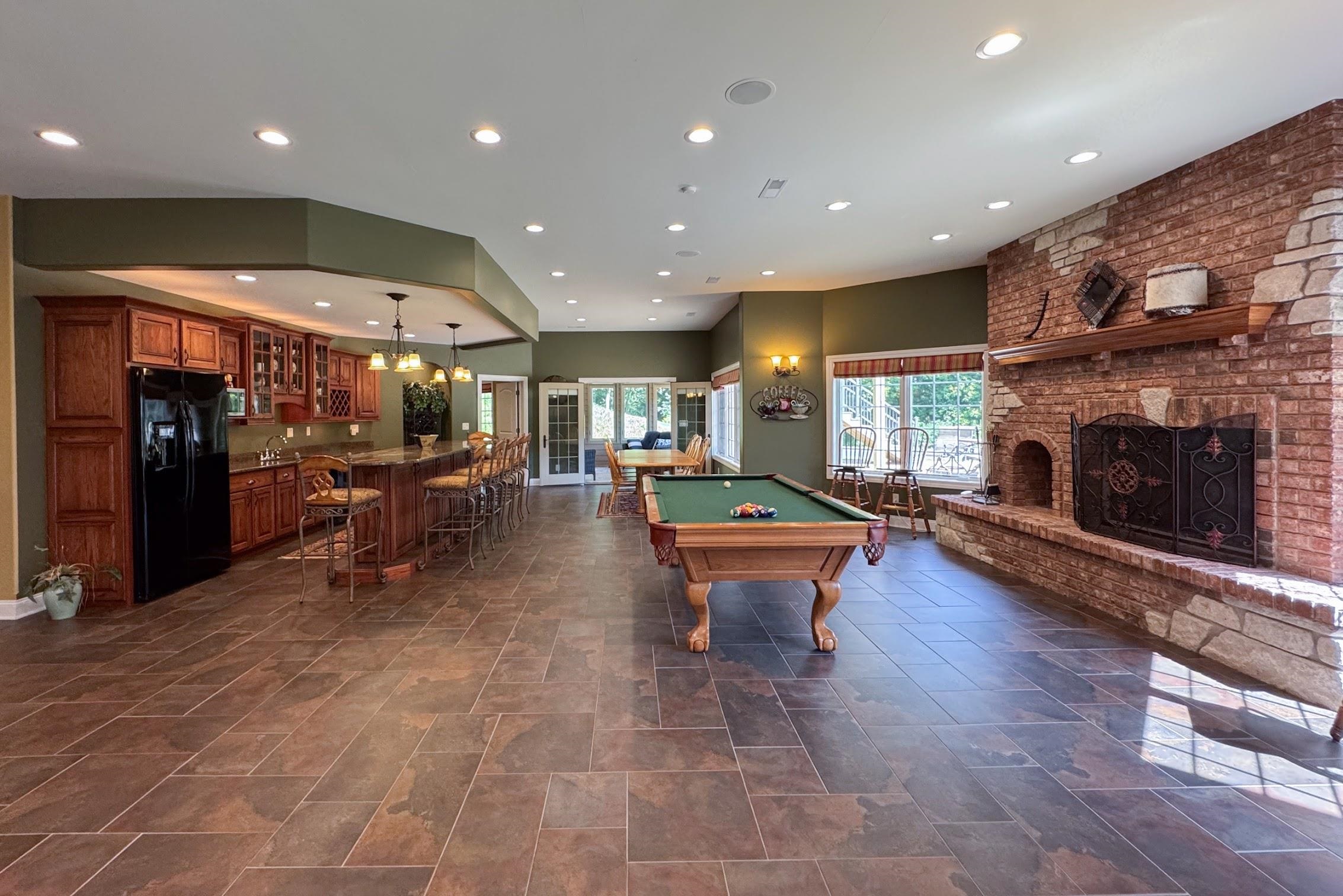 163 Russell Road Oregon, IL 61061 - Photo 53 of 66 a living room with furniture a pool table and a fireplace