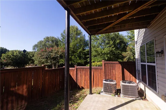 a view of a two chairs in the balcony