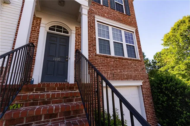 a front view of a house with stairs