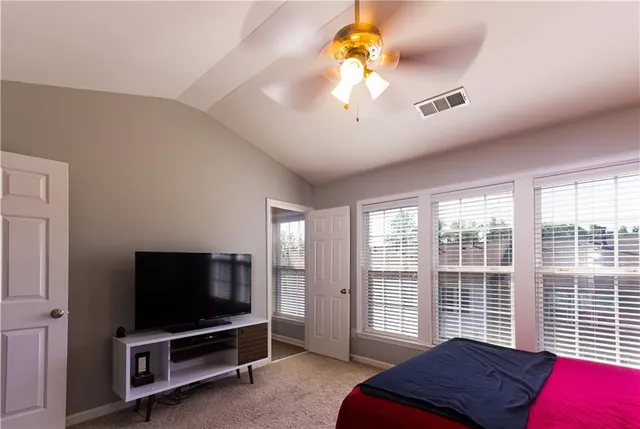 a view of a livingroom with a workspace window and a chandelier