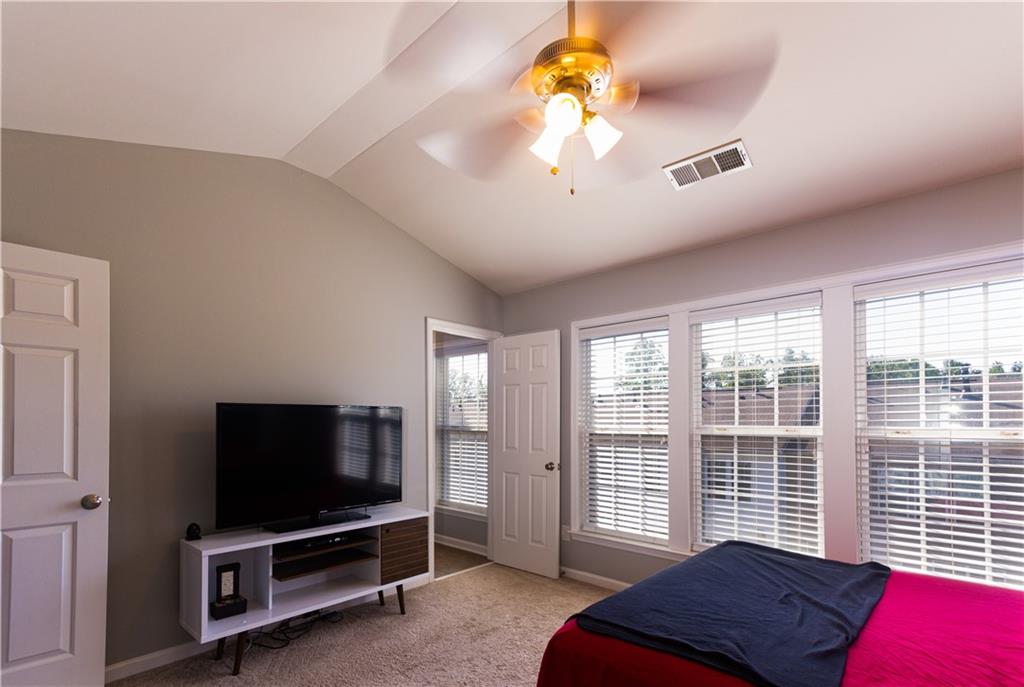 1035 Thornborough Drive Alpharetta, GA 30004 - Photo 6 of 14 a view of a livingroom with a workspace window and a chandelier