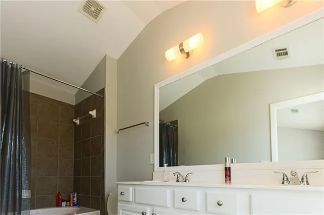 a bathroom with a bathtub and a sink