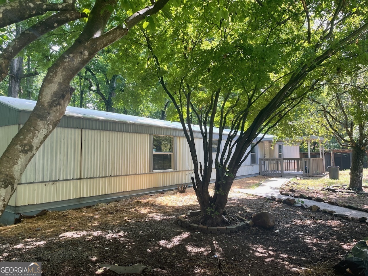 a view of a house with a tree