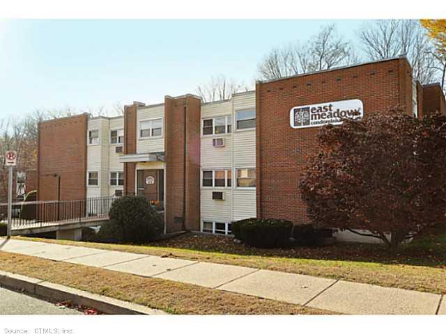 1 Thompson Road, Unit J Manchester, CT 06040 - Photo 1 of 1 a view of a street with a building in the background