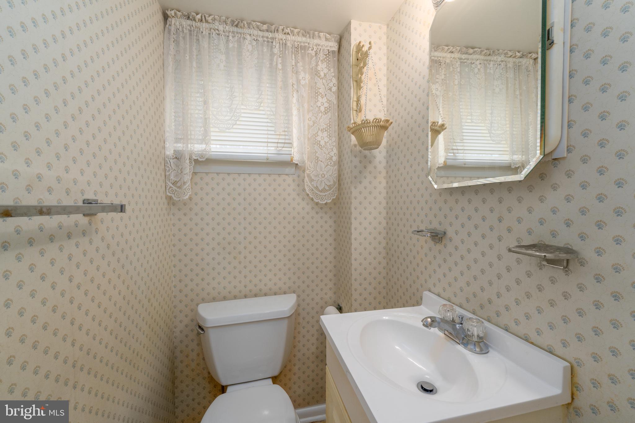 1412 Willshire Drive Aberdeen, MD 21001 - Photo 15 of 28 a bathroom with a sink a toilet and a mirror