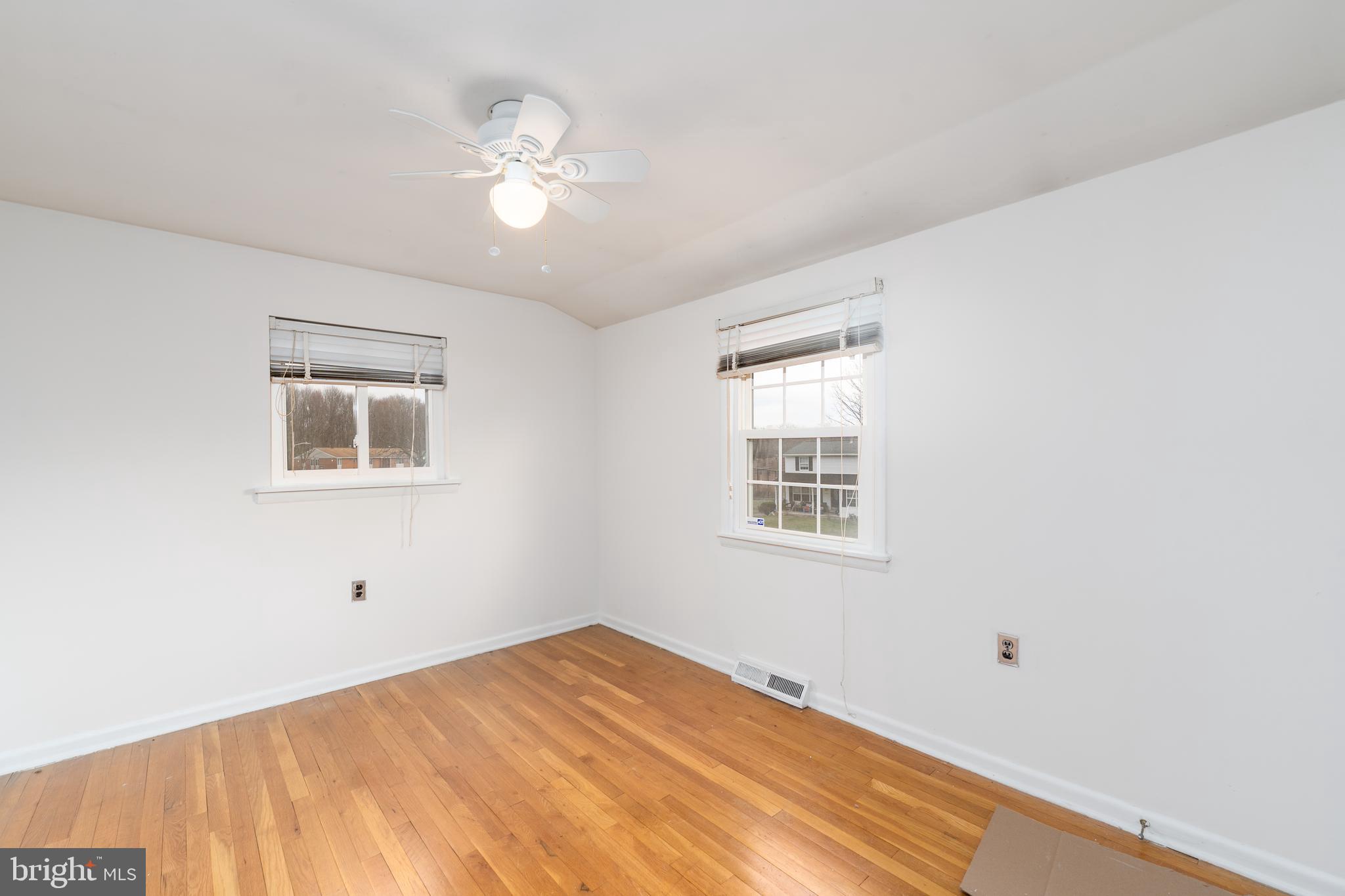 1412 Willshire Drive Aberdeen, MD 21001 - Photo 16 of 28 a view of a bedroom with wooden floor and windows