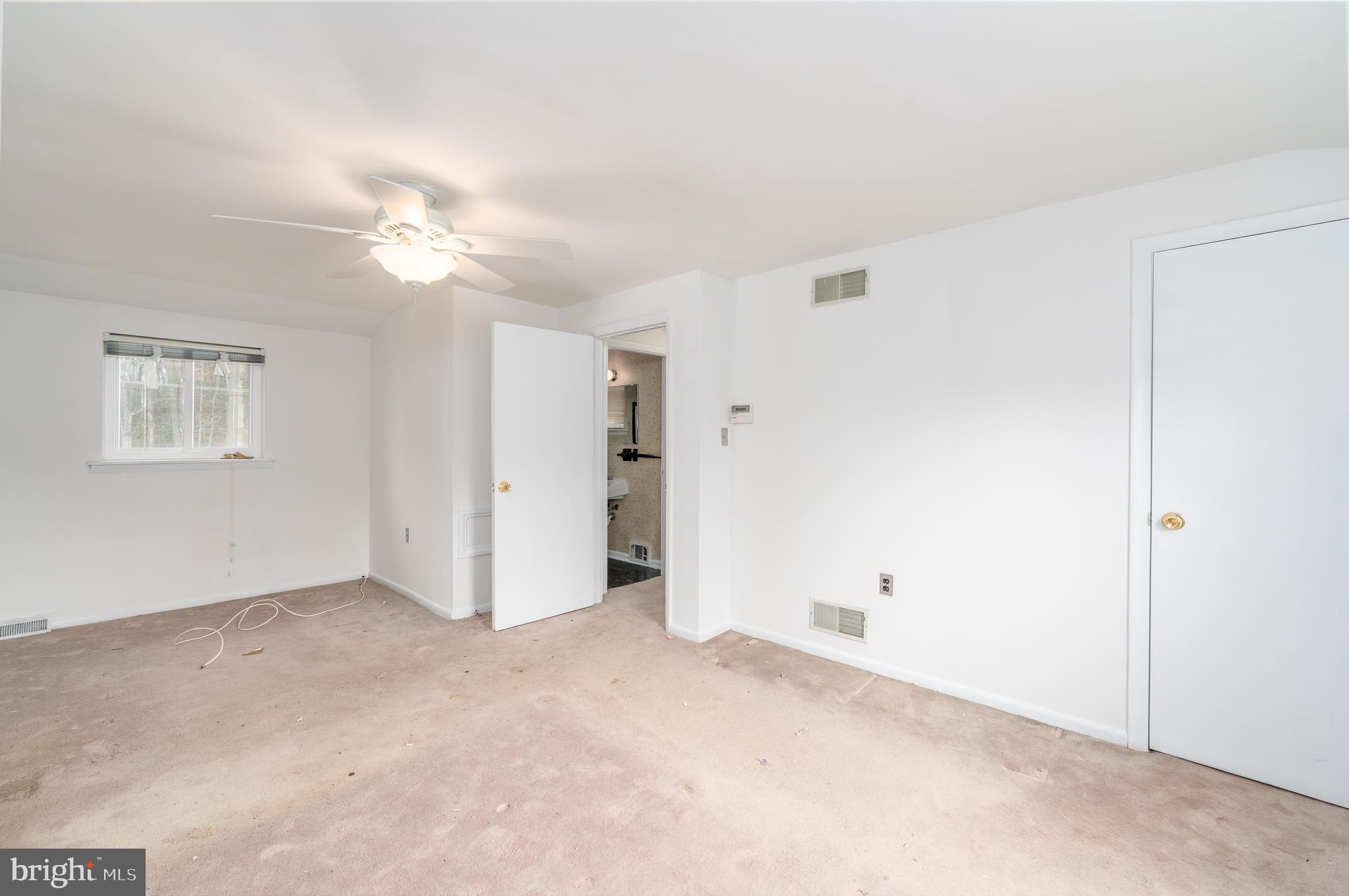 1412 Willshire Drive Aberdeen, MD 21001 - Photo 19 of 28 an empty room with a ceiling fan and a window