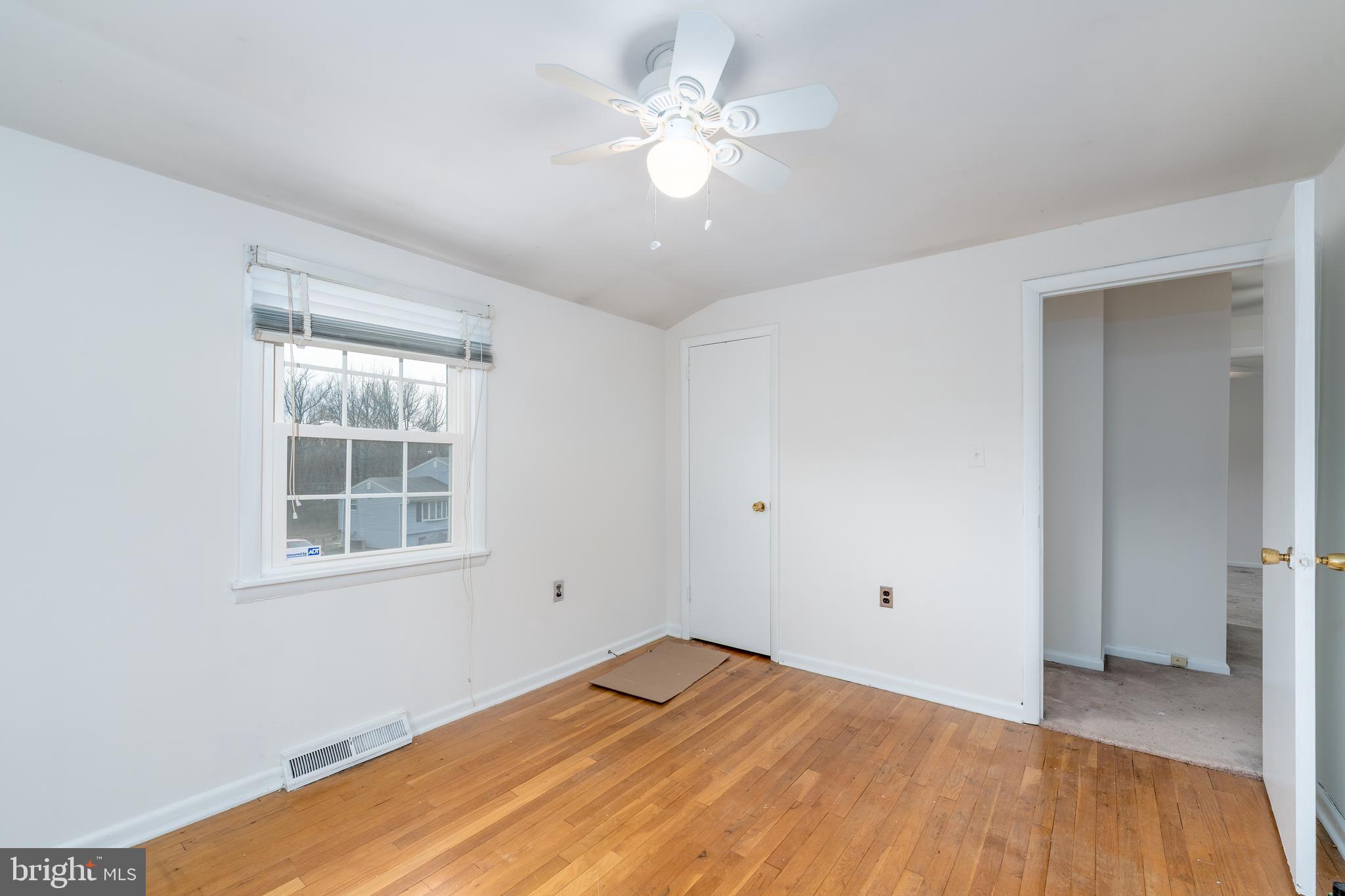 1412 Willshire Drive Aberdeen, MD 21001 - Photo 22 of 28 an empty room with a window and a ceiling fan