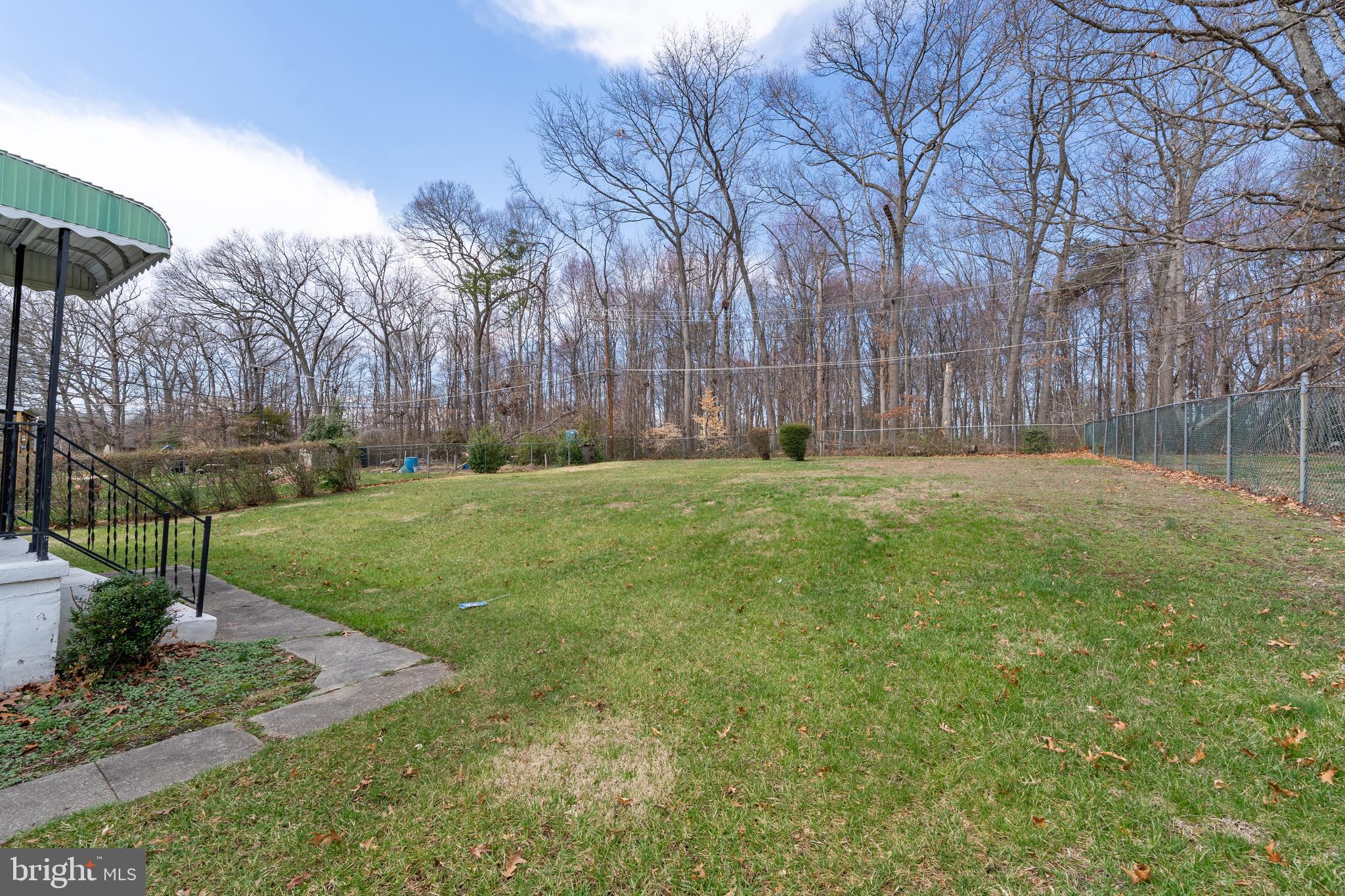 1412 Willshire Drive Aberdeen, MD 21001 - Photo 27 of 28 a backyard of a house with lots of green space and fountain
