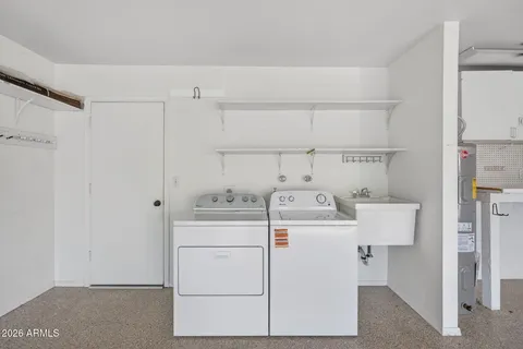 a utility room with dryer and washer