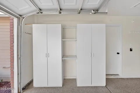 a view of walk in closet with cabinet