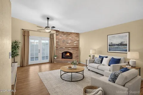 a living room with furniture and a fireplace