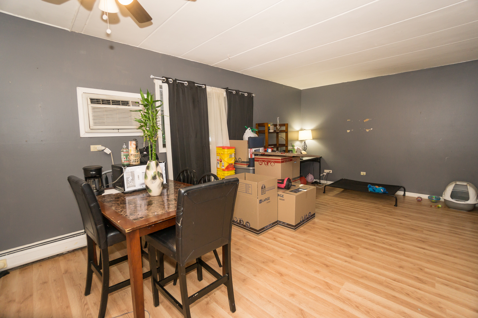 154 East Bailey Road, Unit A Naperville, IL 60565 - Photo 3 of 9 a dining room with furniture and wooden floor