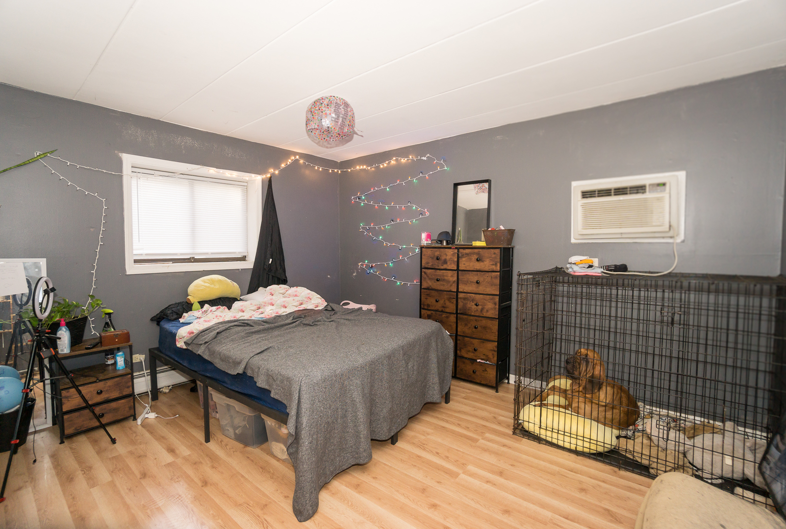 154 East Bailey Road, Unit A Naperville, IL 60565 - Photo 9 of 9 a bedroom with a bed and dresser with wooden floor