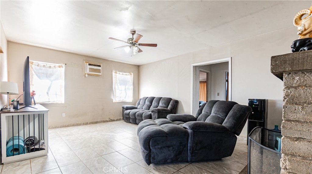 3606 Mojave Road Twentynine Palms, CA 92277 - Photo 12 of 47 a living room with furniture and a window