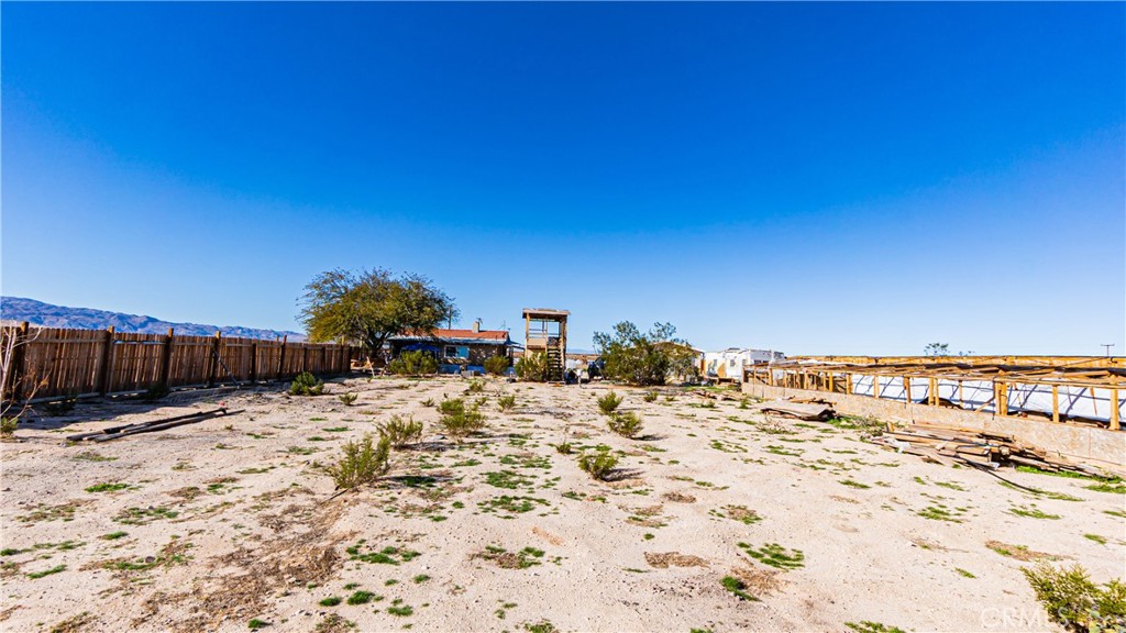 3606 Mojave Road Twentynine Palms, CA 92277 - Photo 37 of 47 a view of a dry yard with wooden fence