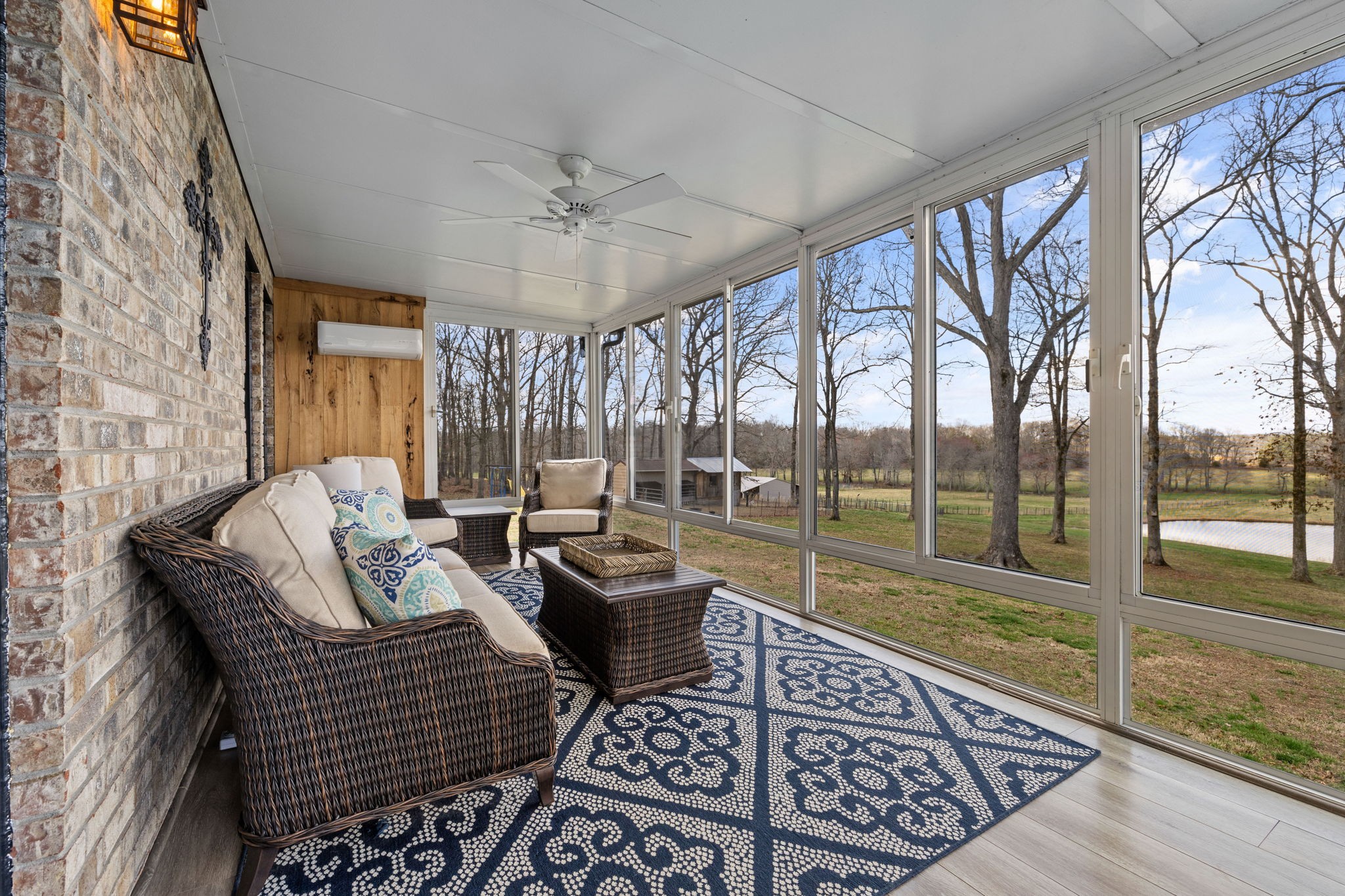 1640 Eno Road Dickson, TN 37055 - Photo 37 of 58 a living room with furniture floor to ceiling window and a table