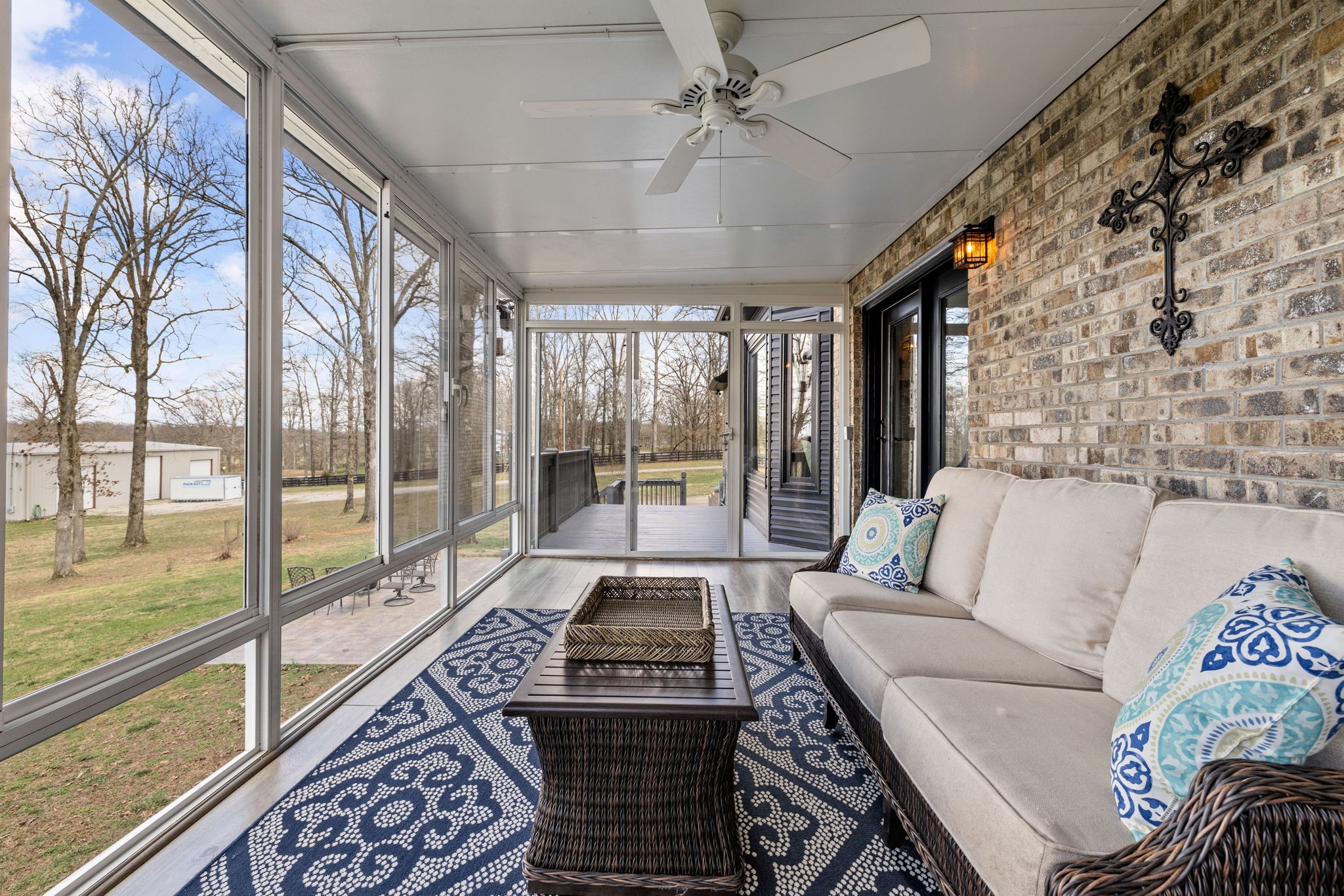 1640 Eno Road Dickson, TN 37055 - Photo 38 of 58 a living room with furniture and a floor to ceiling window