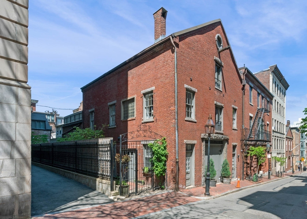 36 Joy Street, Unit F2 Boston, MA 02114 - Photo 11 of 17 a view of a street with a building in the background