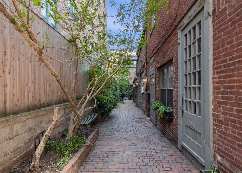 36 Joy Street, Unit F2 Boston, MA 02114 - Photo 17 of 17 a pathway of a house with a yard