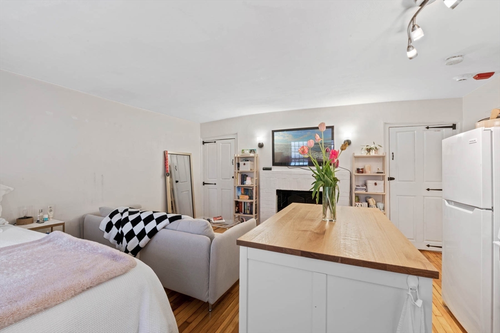 36 Joy Street, Unit F2 Boston, MA 02114 - Photo 8 of 17 a kitchen with sink refrigerator and microwave