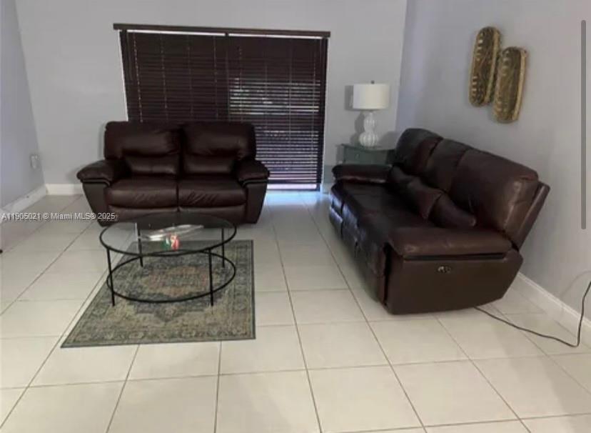 13781 Southwest 66th Street, Unit 229B Miami, FL 33183 - Photo 3 of 6 a living room with furniture and a fireplace